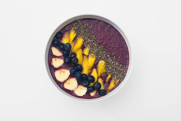 istock acai smoothie bowl with chia seeds, mango, blueberries and bananas 491872660