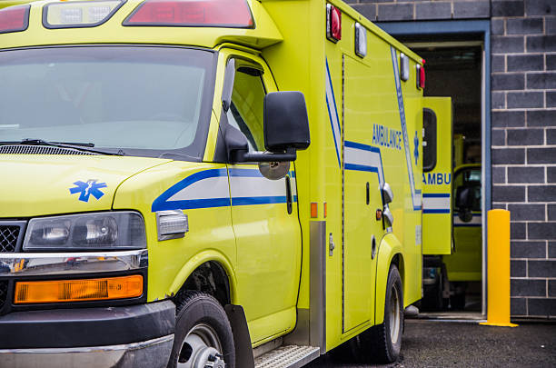 A close-up of an ambulance on the driver's side, from the headlight to the rear of the vehicle