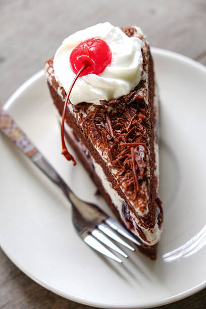 istock Dark chocolate cake on wood background 491875039
