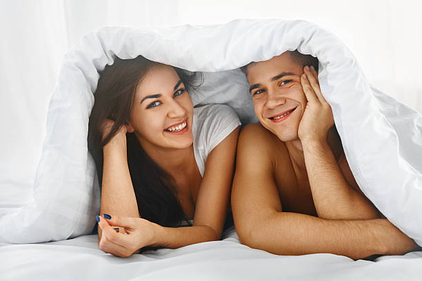 istock Happy couple in bed 491875812