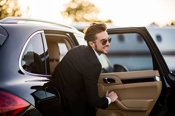 istock Man at the airport exiting from the car 491875920