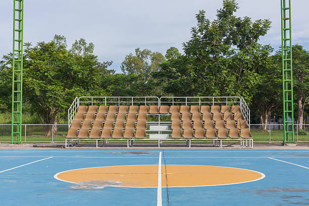 Small empty old brown grandstand with seating Small empty old brown grandstand with seating tribune tower stock pictures, royalty-free photos & images