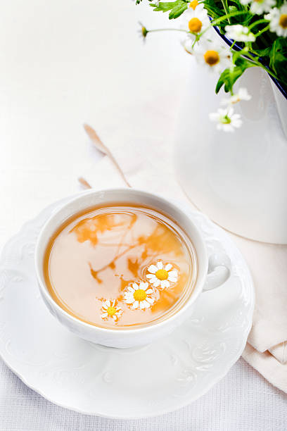 Camomile hebal tea in a white cup with