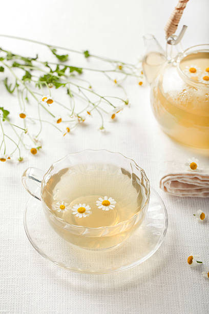 istock Camomile hebal tea in a white cup with 491876236