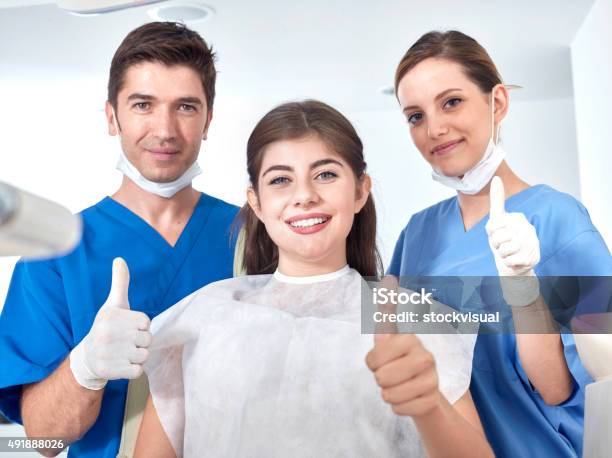 Dentists And Patient Making Sign To Confirm Stock Photo - Download Image Now - 2015, Adult, Adults Only