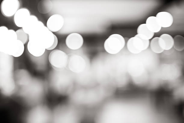 istock Black and white blur background, bokeh light at coffee shop 491888048
