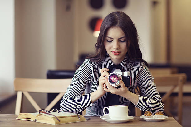 istock young girl with a vintage camera 491888416
