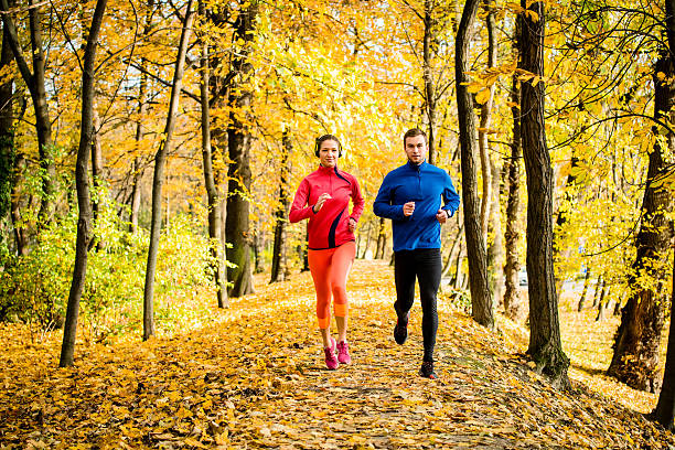 istock Friends jogging in autumn nature 491888840