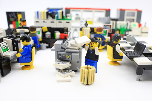 Hong Kong, Сhina - March 25, 2015:  Studio shot of Lego people in office, combine from different set. Legos are a popular line of plastic construction toys manufactured by The Lego Group in Denmark