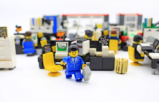 Hong Kong, Сhina - March 25, 2015:  Studio shot of Lego people in office, combine from different set. Legos are a popular line of plastic construction toys manufactured by The Lego Group in Denmark