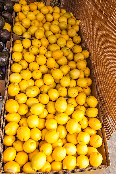 limões em fruitstand - fruitstand - fotografias e filmes do acervo