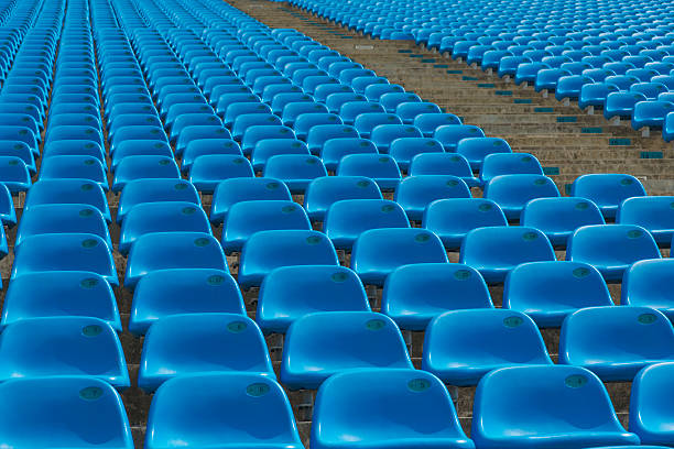 istock Field of empty blue plastic stadium seats. 491889945