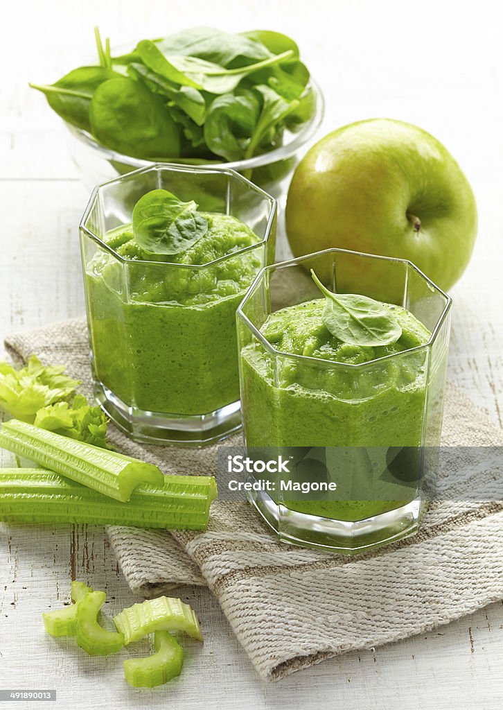 glass of green smoothie glass of green smoothie on wooden table Apple - Fruit Stock Photo