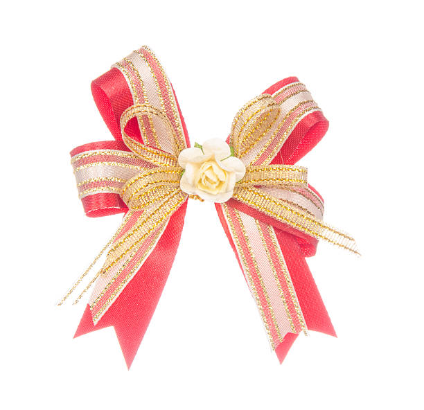 istock Red ribbon bow with flower isolated on white 491890762