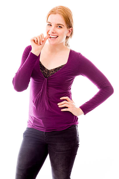 istock Young woman biting nail and smiling 491892199