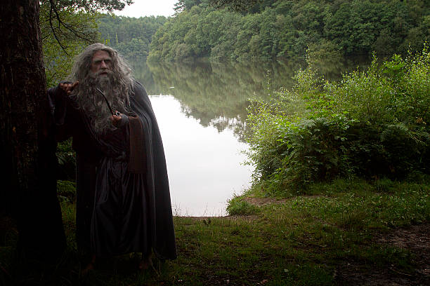 istock Old man in costume by a lake 491892454