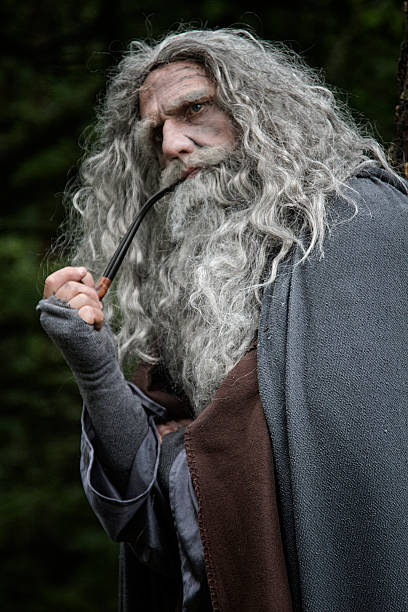 istock Senior man in costume with a pipe 491892748