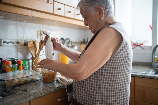 istock Elderly woman cooking 491892872