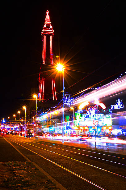 Blackpool Tower and The Golden Mile Illuminations at night The Famous Blackpool Tower and lights along the stretch of promenade known as the Golden Mile in Blackpool, Lancashire at night, photographed on a long exposure with light streaks during the yearly 'illuminations' spectacle. Blackpool Tower stock pictures, royalty-free photos & images