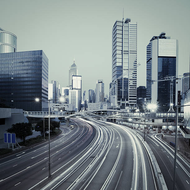 istock Road light trails on streetscape buildings in HongKong 491893449