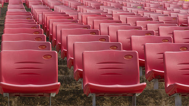 istock Field of empty red plastic stadium seats. 491893905