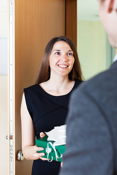 istock woman giving  presentto man 491895155