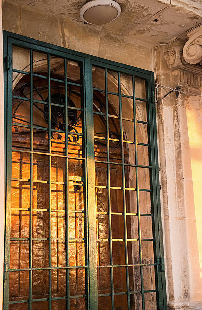 istock Sunset lights on metal rod gate 491896077