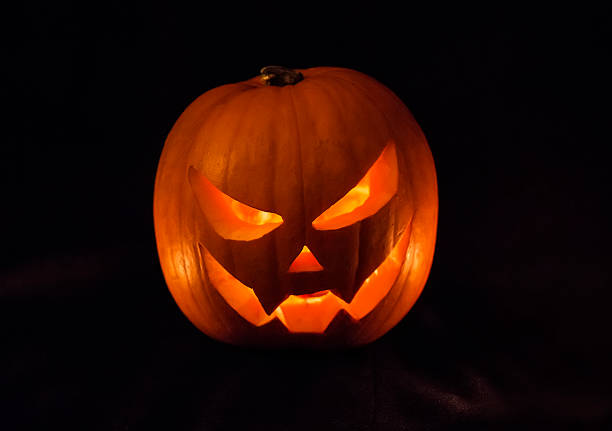istock Halloween pumpkin with a candle 491904204
