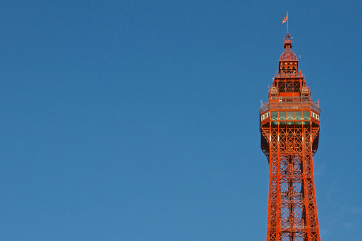 Closeup of the top of the Victorian Blackpool Tower in Blackpool, Lancashire.  Photograpghed on a sunny day with a deep blue sky