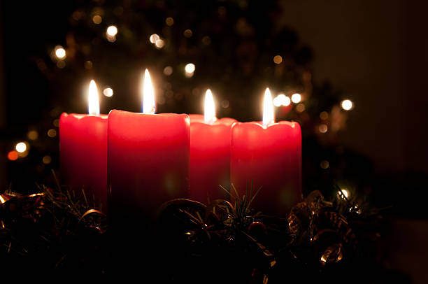 istock Christmas advent wreath with burning candles 491904630