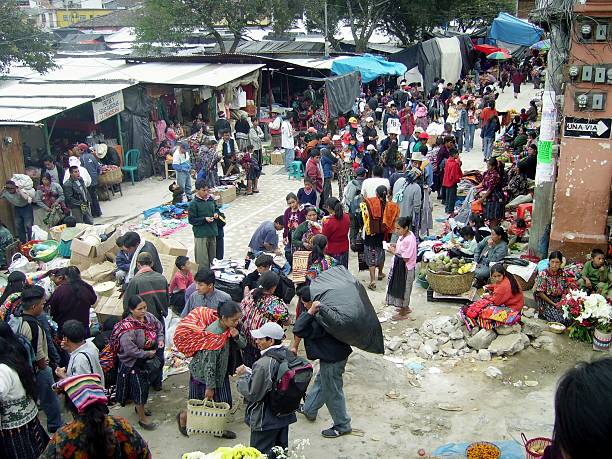 Chichicastenango, Guatemala - December 3, 2005: Sunday market in Chichicastenango, Guatemala. People selling every sort of food and goods on the streets of the small village.