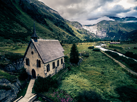 Mountain landscape in the Swiss Alps, as seen from the small village of Gletsch and looking towards the Rhone Glacier / Furka Pass.