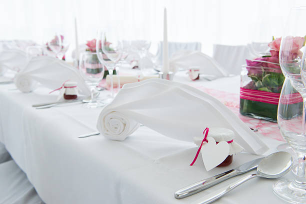 istock white nuptial decorated wedding table with napkin and flowers 491907358
