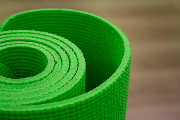 istock Green Rolled-up yoga mat 491909644