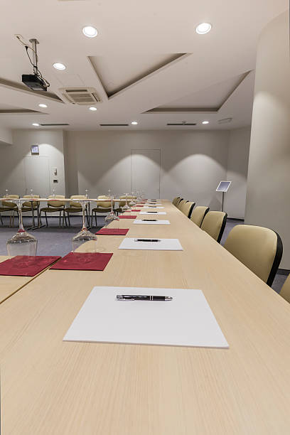 istock Papers and pens laid out on conference room desks 491911037