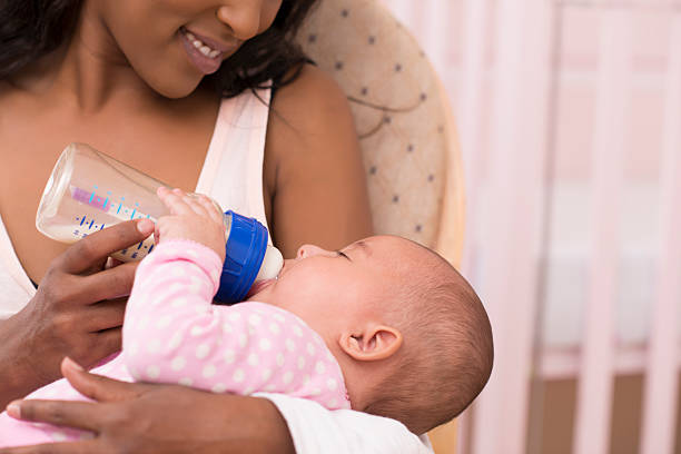 istock Mother feeding her newborn baby. 491911633