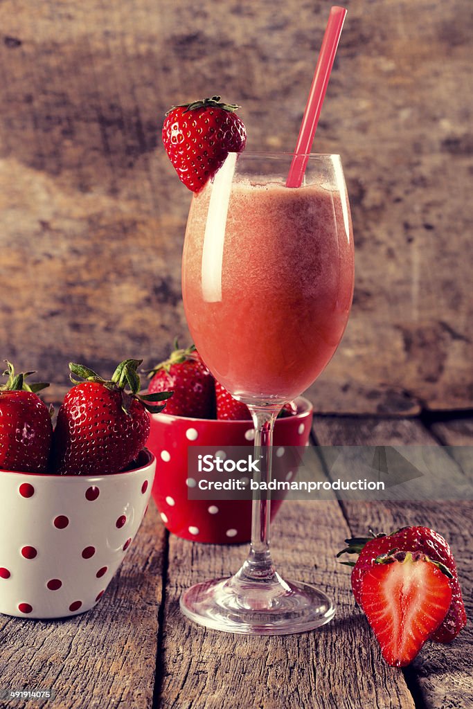 Strawberry smoothie Fresh strawberry smoothie in the glass.Selective focus on the smoothie Alcohol - Drink Stock Photo