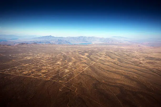 The reservation is south of the Grand Canyon and this shot is from a helicopter looking towards Lake Mead. The settlement in the foreground is Meadview.