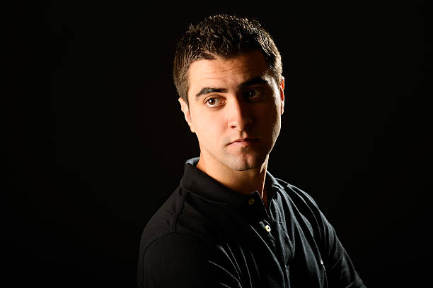 istock Young casual man on black background 491914647
