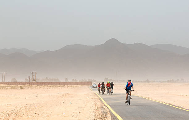 istock Mountainbiking against sand storm, Jordan 491914973