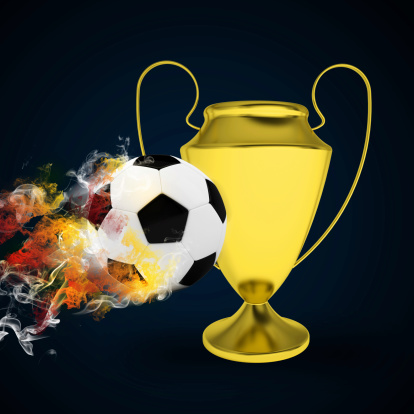 Soccer Cup and ball in colored smoke. Sport concept