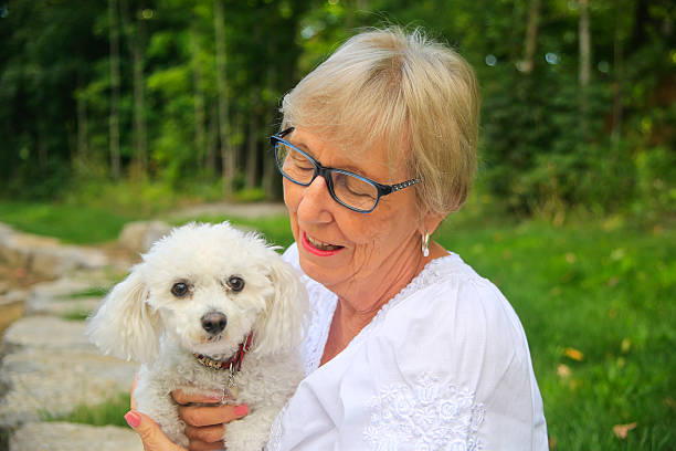 istock Senior Woman Holding Her Dog 491919010