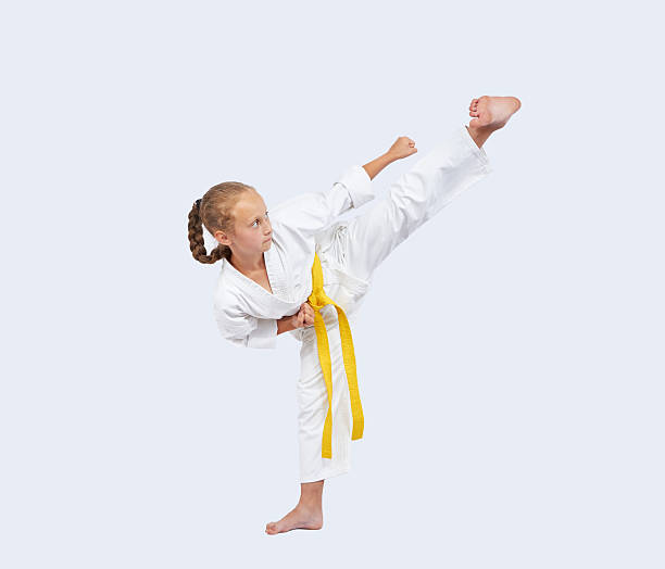 istock On a light background sportswoman beats blow leg 491919630