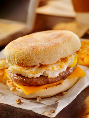 Sausage and Egg Breakfast Sandwich with a Hash brown Patty at your Desk - Photographed on a Hasselblad H3D11-39 megapixel Camera System