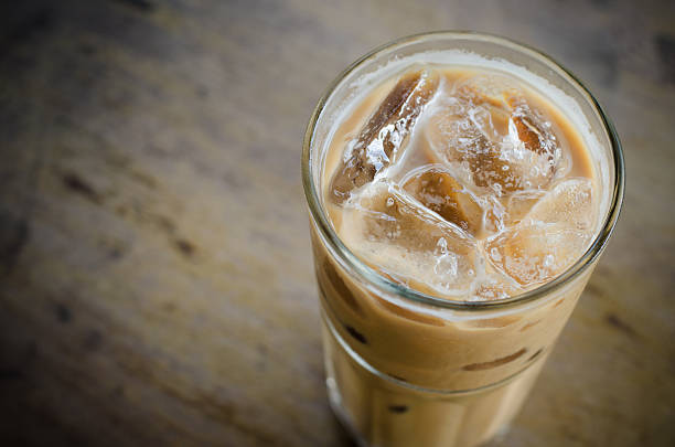 istock Glass Of Cold Coffee On Wood Table 491934844