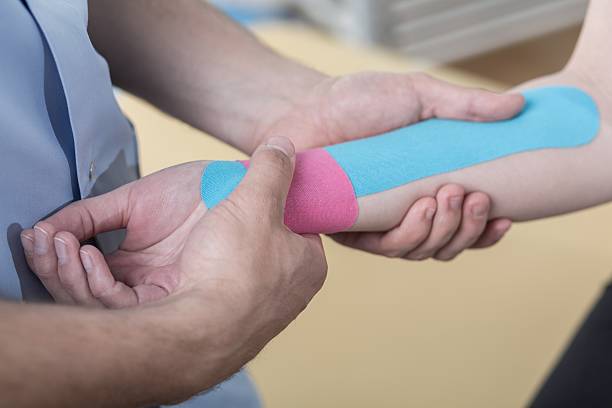 istock Kinesiology taping after wrist injury 491935842