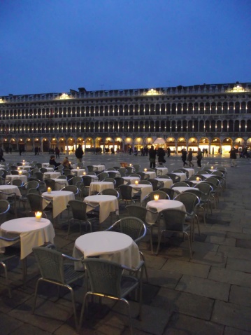 Restaurant terrace in evening on St. Mark's Square, Venice - Italy