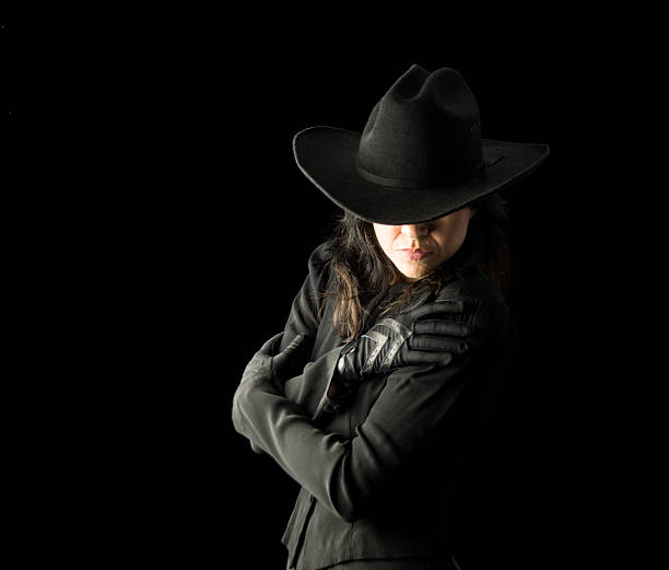 istock Woman in Black Wearing Cowboy Hat 491937374