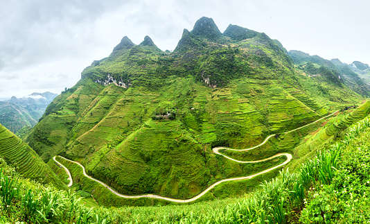 Supply lines of Ma Pi Leng Pass rugged northwest Vietnam's most beautiful with winding road full of clouds mountainside. We come to love the country of Vietnam more