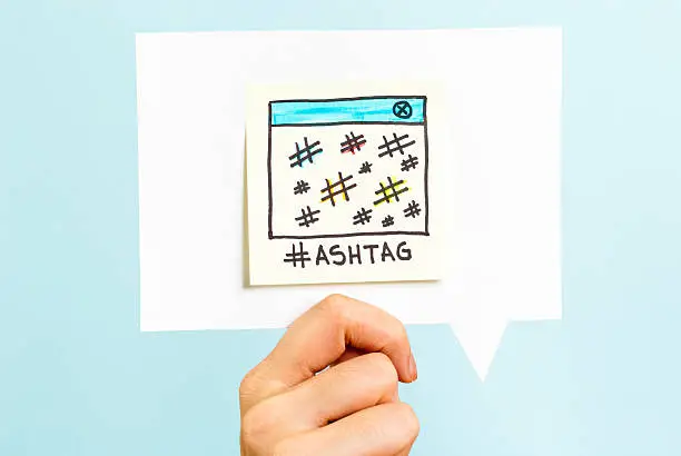 Photo of Social media hashtags hash character number sign on speech bubble